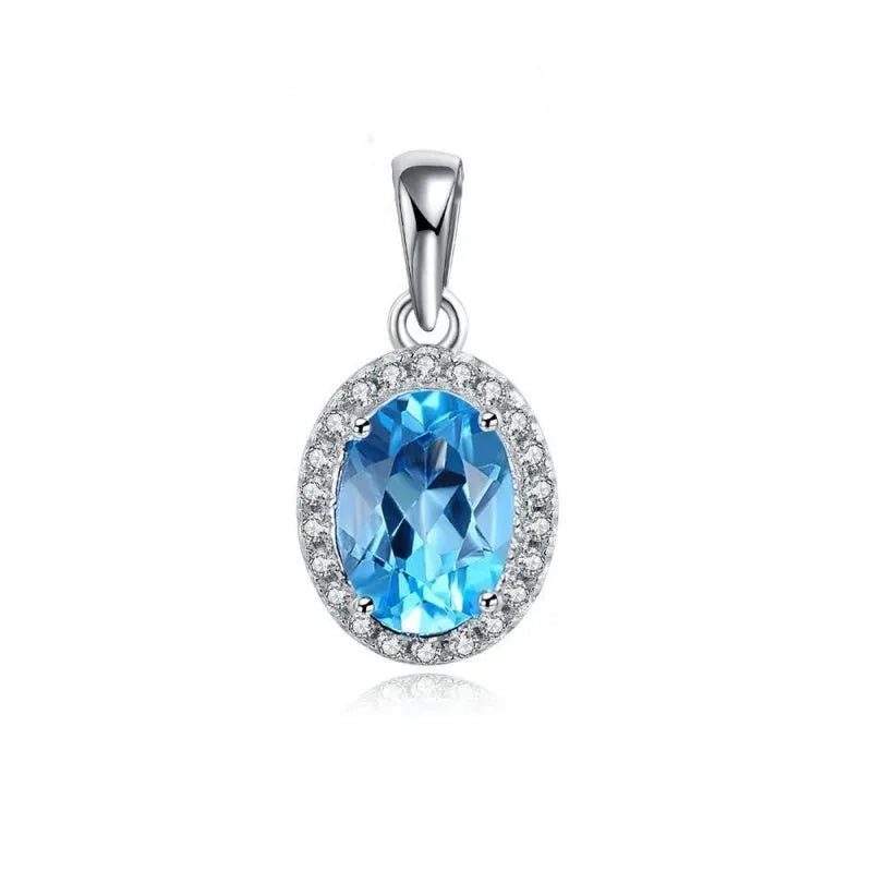 Women's 925 silver blue topaz jewellery set showing geometric earrings, ring, pendant and necklace.