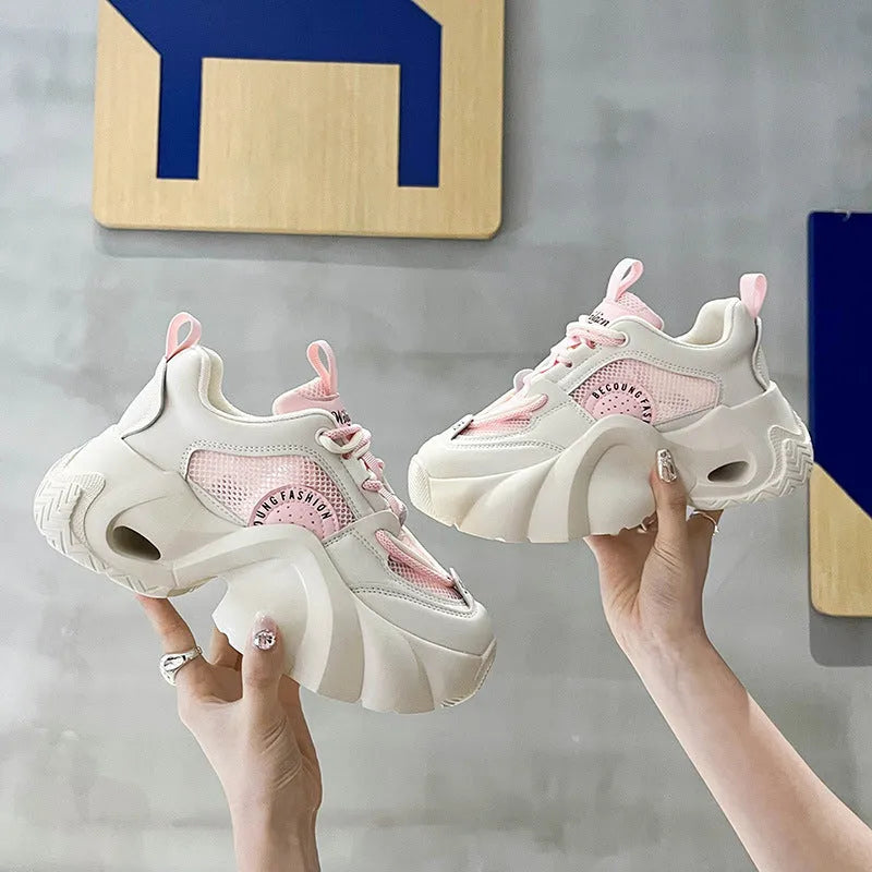 Women's pink sneakers with cross shoulder straps and thick sole design