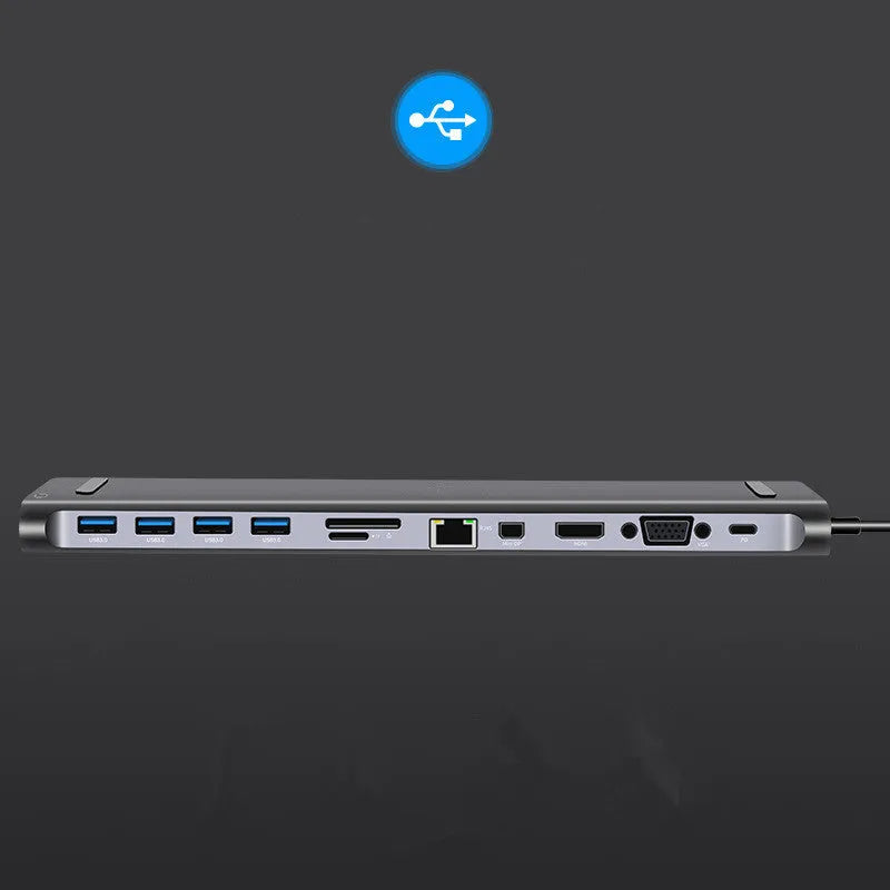 Grey aluminium alloy 12-in-1 Type-C hub with HDMI, VGA, USB 3.0, Ethernet, and PD ports on a desk