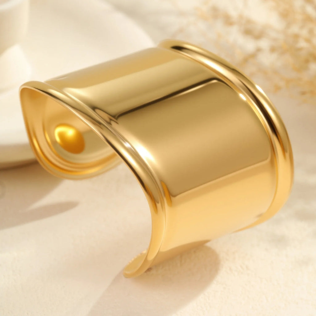 Women's gold-plated wide bracelet with stainless steel construction and geometric design