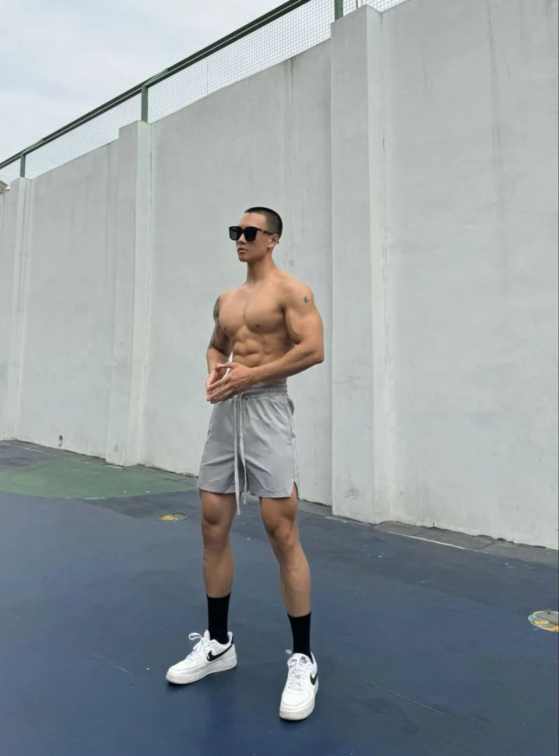 Men's black quick-drying nylon ice silk shorts with double-layer quarter-length design