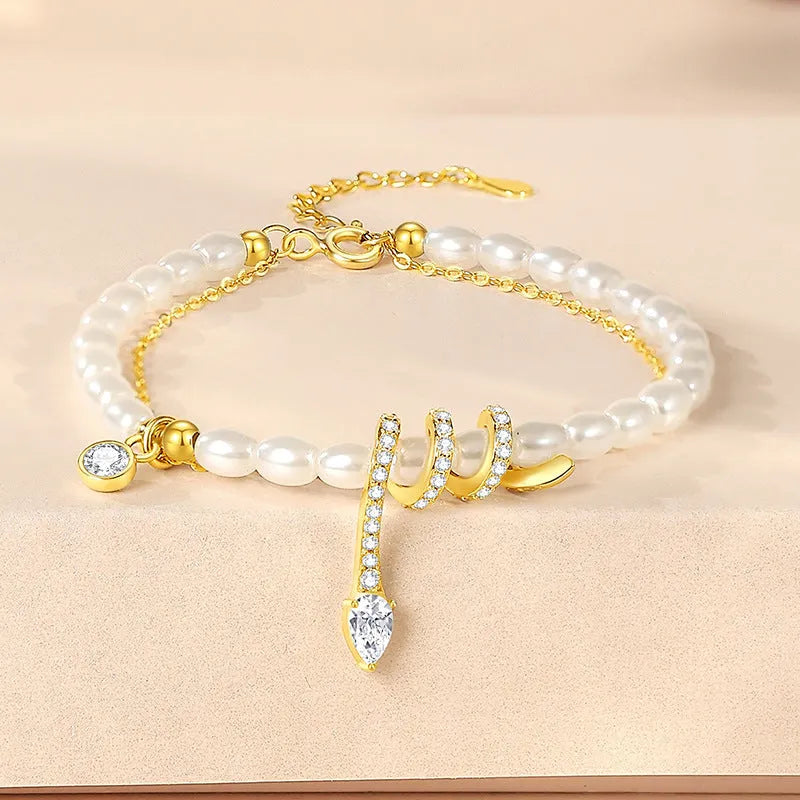 Women's snake motif beaded bracelet in 925 silver with gold or white gold colour finish.