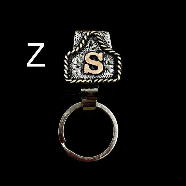 Handmade metal cow tag belt keychain in a selected colour from the A-Z letter range.