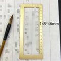 Solid brass calligraphy paper weight with carved square design for paper pressing