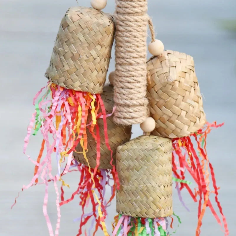 Colourful shredded paper parrot toy with wood and sisal construction measuring 15 by 35 centimetres