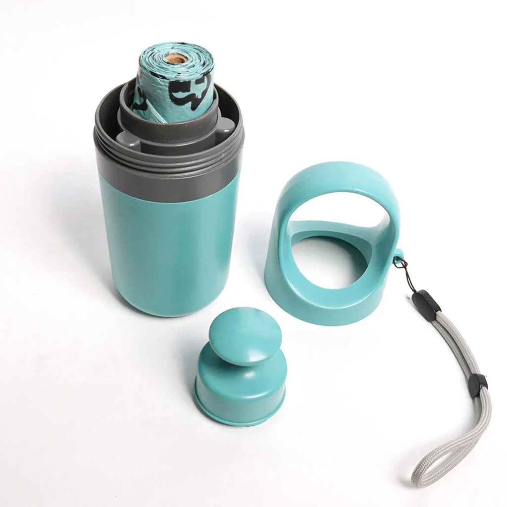 Blue plastic pet pooper scooper with claw mechanism and built-in garbage bag dispenser for outdoor waste collection