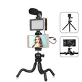 Black octopus tripod with flexible legs and a fill light microphone, shown mounted on a post.
