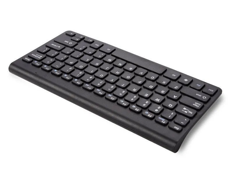Black wireless keyboard and mouse set with USB receiver on wooden desk