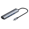 Mechanical Eye Type-C Docking Station in dark grey, compatible with MacBook and iPhone, on a desk