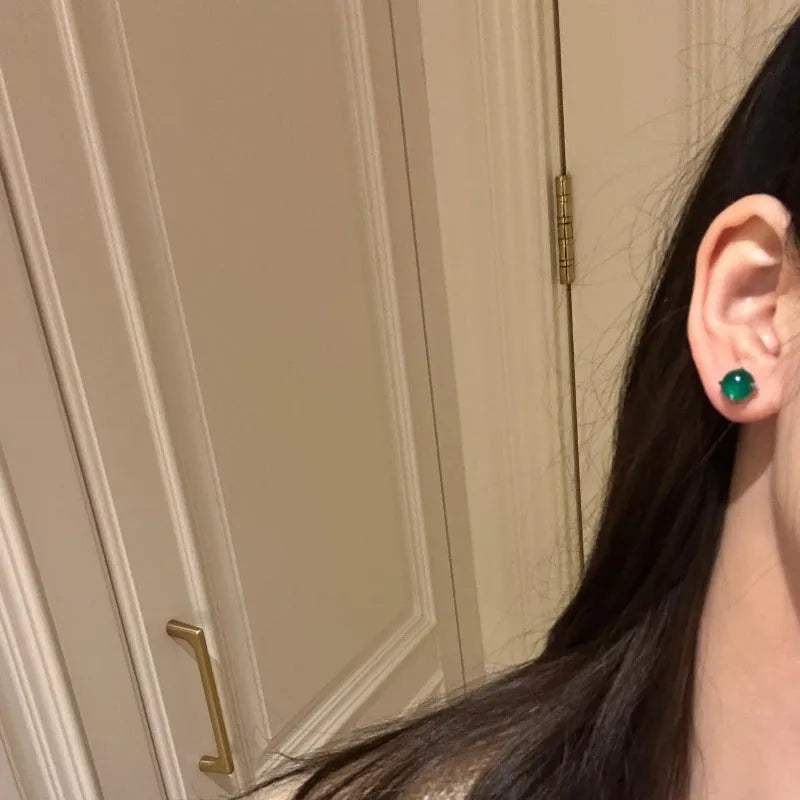Chinese style chalcedony stud earrings with geometric design and claw setting