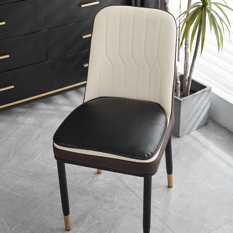 Leather horseshoe-shaped seat cushion in beige colour showing curved design and non-slip underside