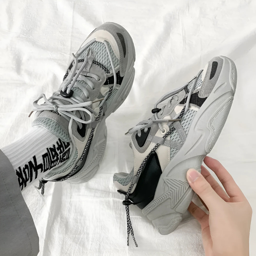 Men's white Korean dad style platform trainers with lace-up front and mesh lining.