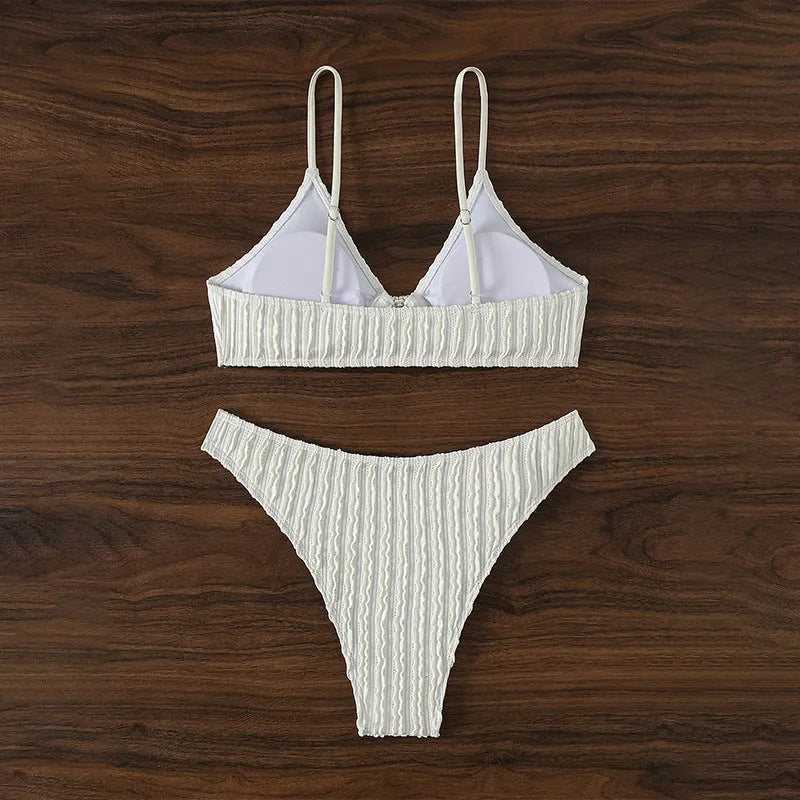 White women's v-neck swimsuit with sleeveless top and split shorts on mannequin