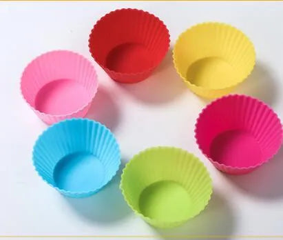 12 nonstick reusable silicone cupcake liners in six colours arranged for baking