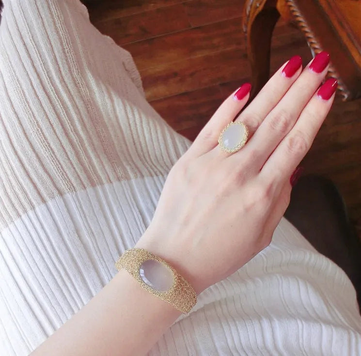 14k gold wire natural white chalcedony bracelet on wrist with adjustable chain closure