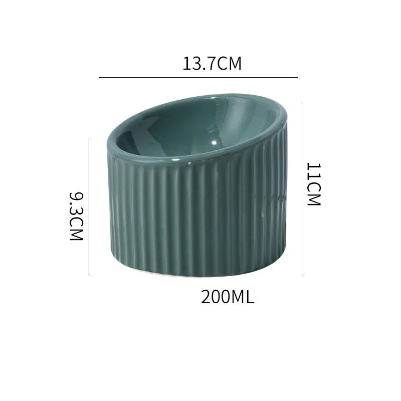 Ceramic elevated cat bowl in round tilted design with raised height for indoor cats