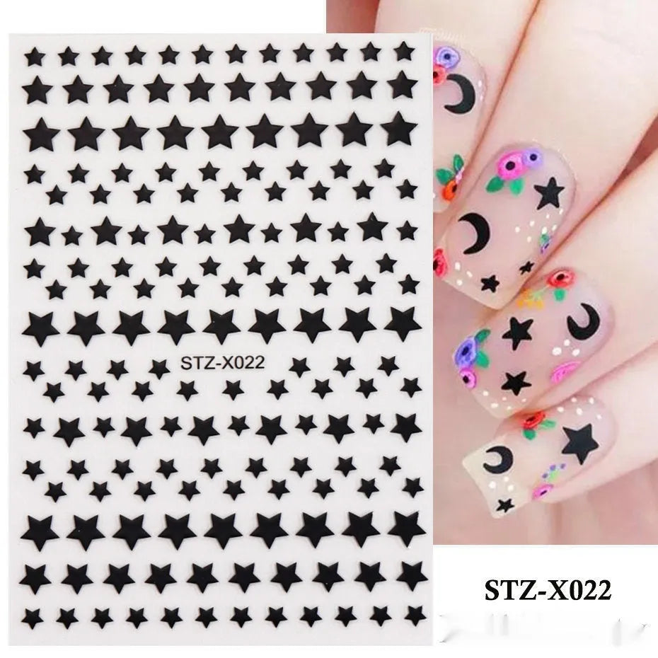 Pack of black and silver striped nail art stickers with cartoon and love pattern designs.
