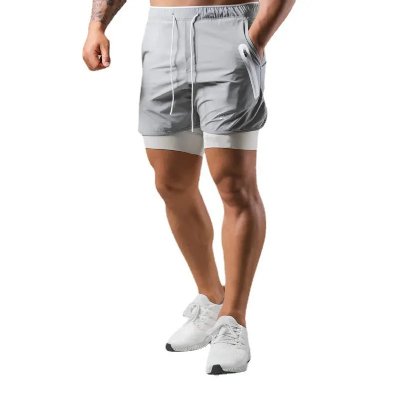 Men's double layer running shorts in light slate green and black, with built-in lining and mid-rise waist for fitness use