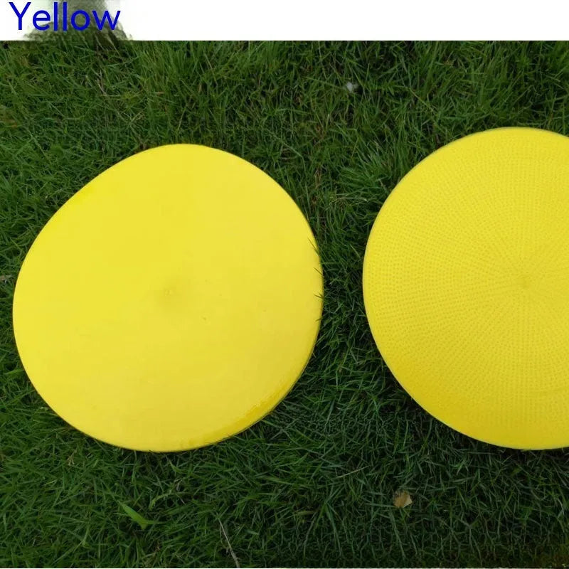 Soft yellow football landmark pad disc on grass, 23cm diameter, for training targets.