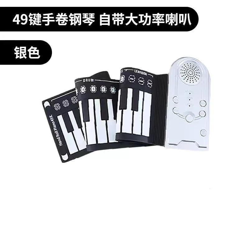 Portable folding 49-key electronic keyboard with speaker in compact rolled position showing silicone rubber keys and ABS plastic controls