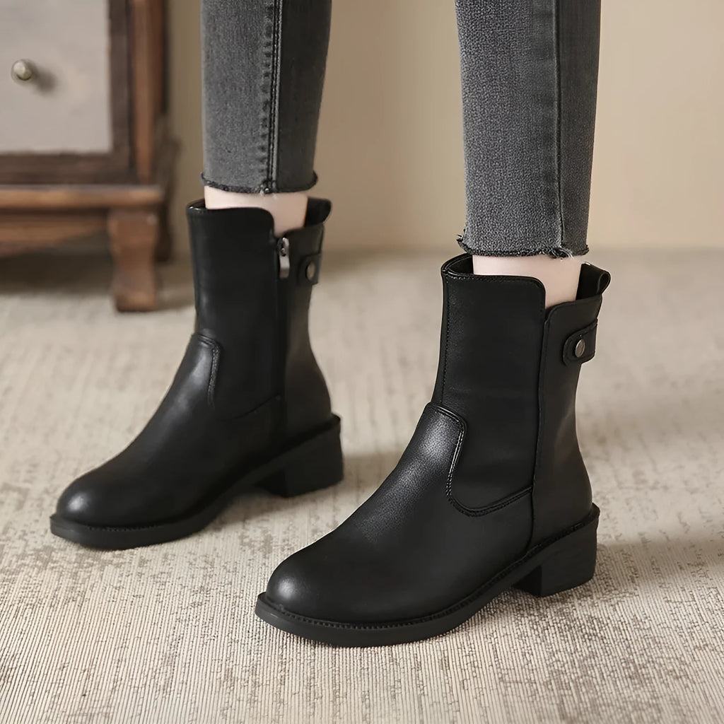 Black women's ankle boots with side zip, round toe, and a low block heel.