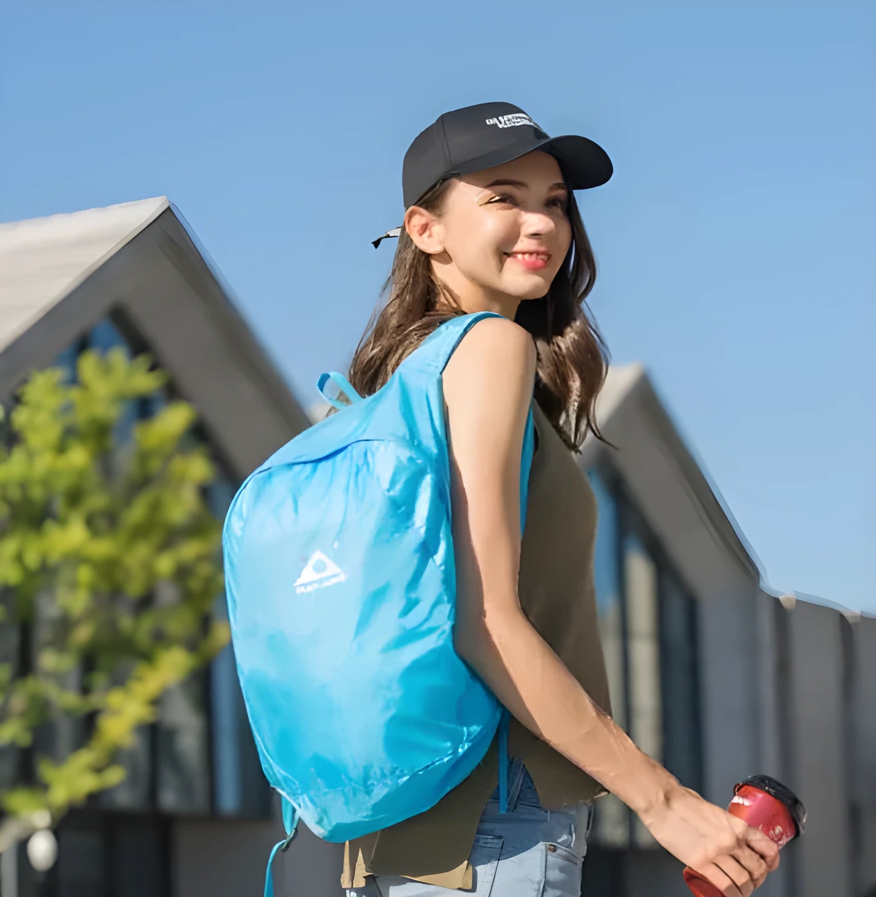 Ultra-thin foldable 20L waterproof polyester backpack in sky blue, folded to fist size