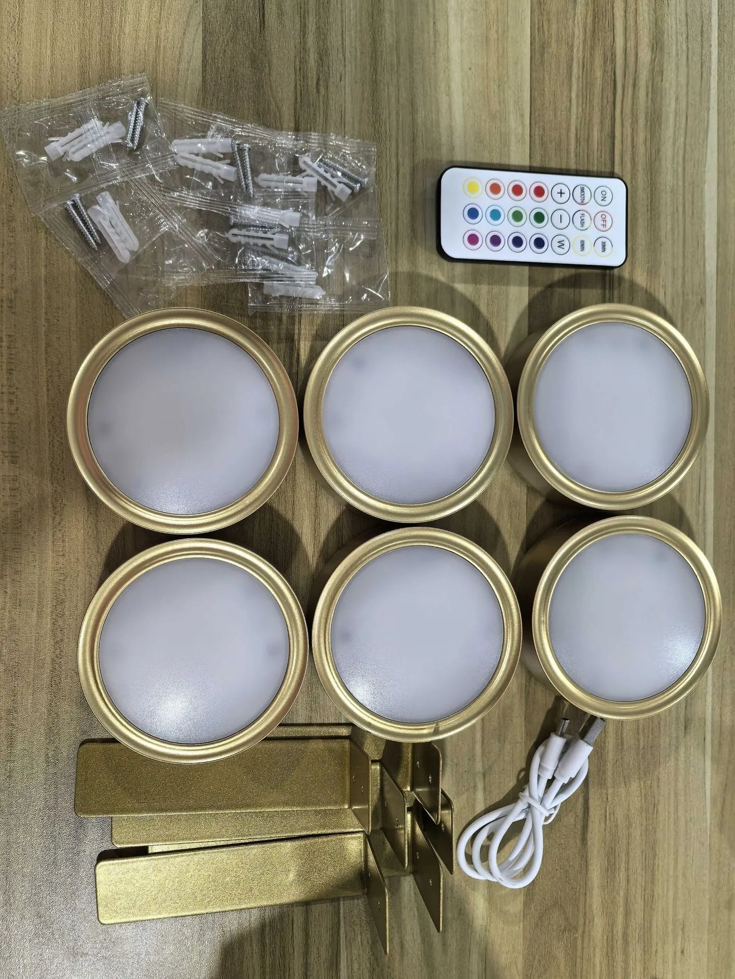 Wireless LED painting lamp with a magnetic mounting belt and remote control in black finish.