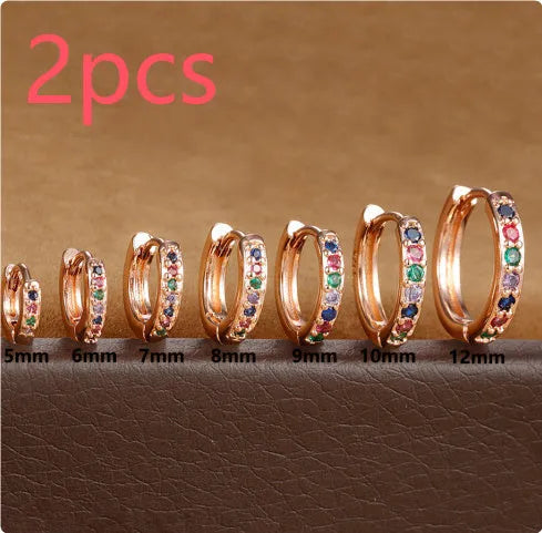 Circle zircon perforated stud earrings in gold, rose gold, and silver colour options with geometry round design