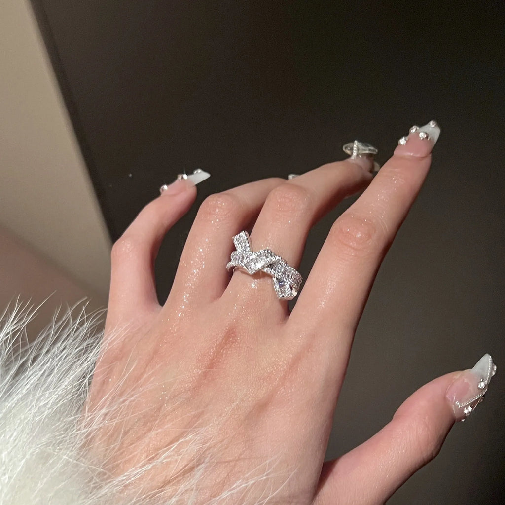 Silver cross open ring with bow shape, copper base with electroplated finish, minimalist light luxury style