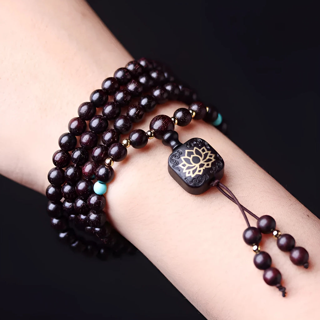 Zambian rosewood Buddha beads bracelet with flat lotus pendant showing 108 wooden beads