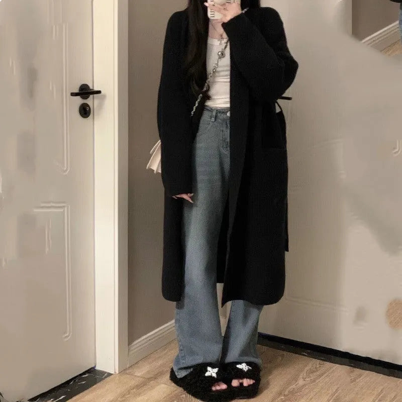 Loose thick chenille cardigan for women in a dark grey colour, showing 3D pattern and mid-length fit.