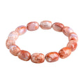 Natural cherry agate barrel bead bracelet with Ruyi decoration on white background