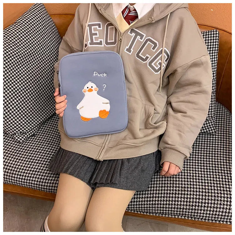 Blue tablet case with embroidered cartoon duck design and zipper closure