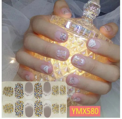 Full nail stickers set of 14 sheets showing 16 colour options in a flat lay arrangement