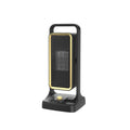 Black HQ-500A desktop PTC ceramic heater with control knob on a wooden desk.