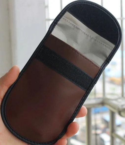 Black microfiber Faraday cage pouch for blocking car key fob and smartphone RFID signals.