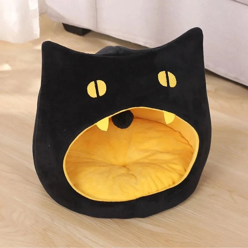 Soft warm cat bed in cat shape design with anti-slip bottom, machine washable, available in S and L sizes.