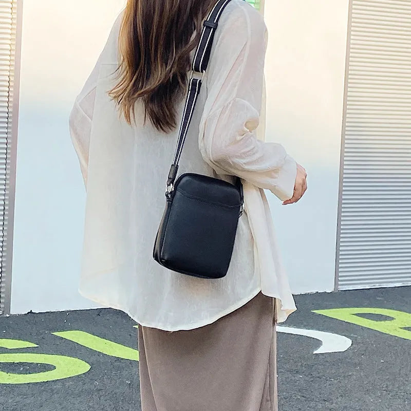 Solid colour PU leather mobile phone crossbody shoulder bag shown in beige.