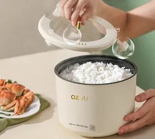 Compact round mini rice cooker with steaming pan and non-stick inner pot for 1-2 people