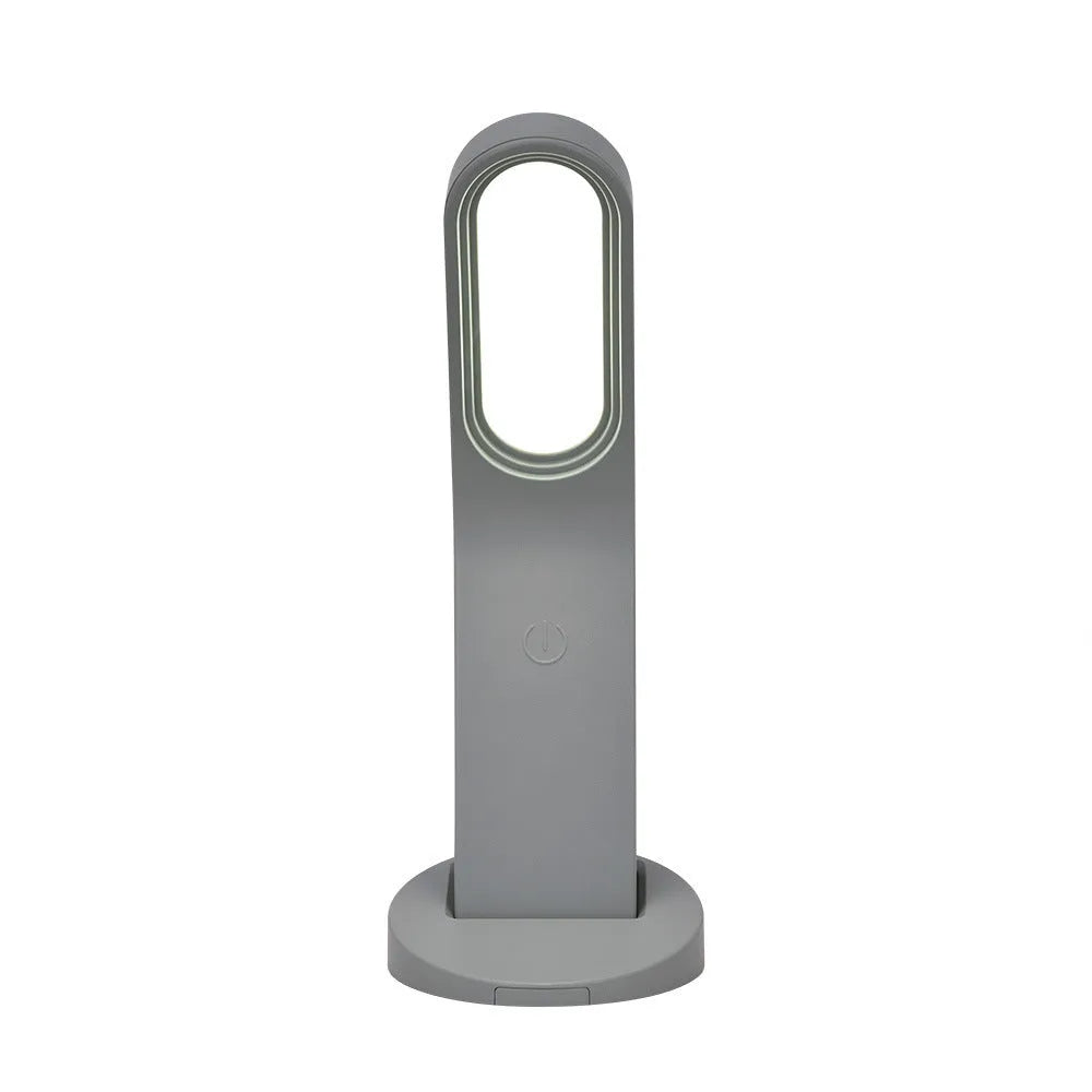 Simple white LED desk lamp with touch control and USB cable on a modern desk
