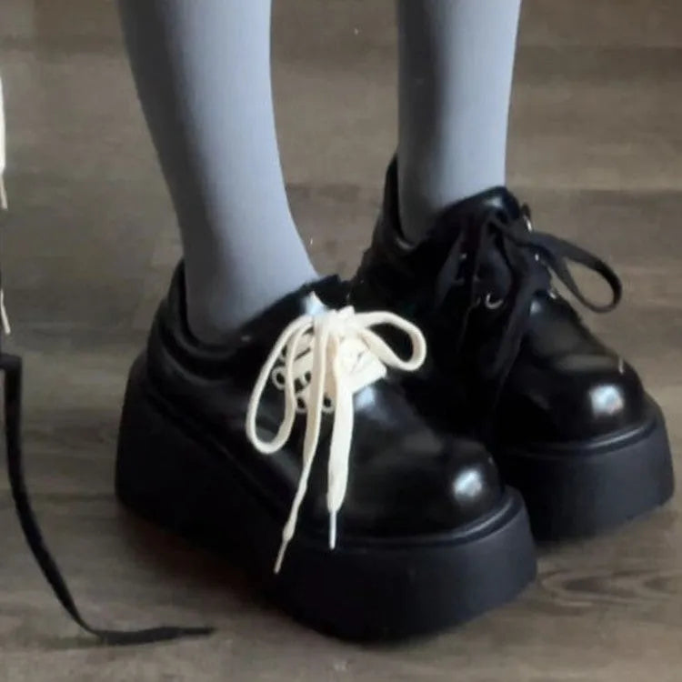 Matte black women's retro lace-up shoes with a chunky block heel and round toe.