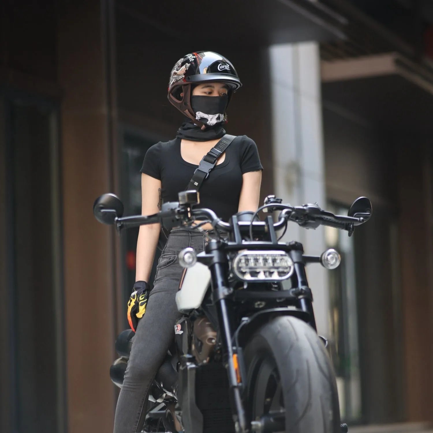Retro electric motorcycle helmet in bright black with whiskers design on side and front vents