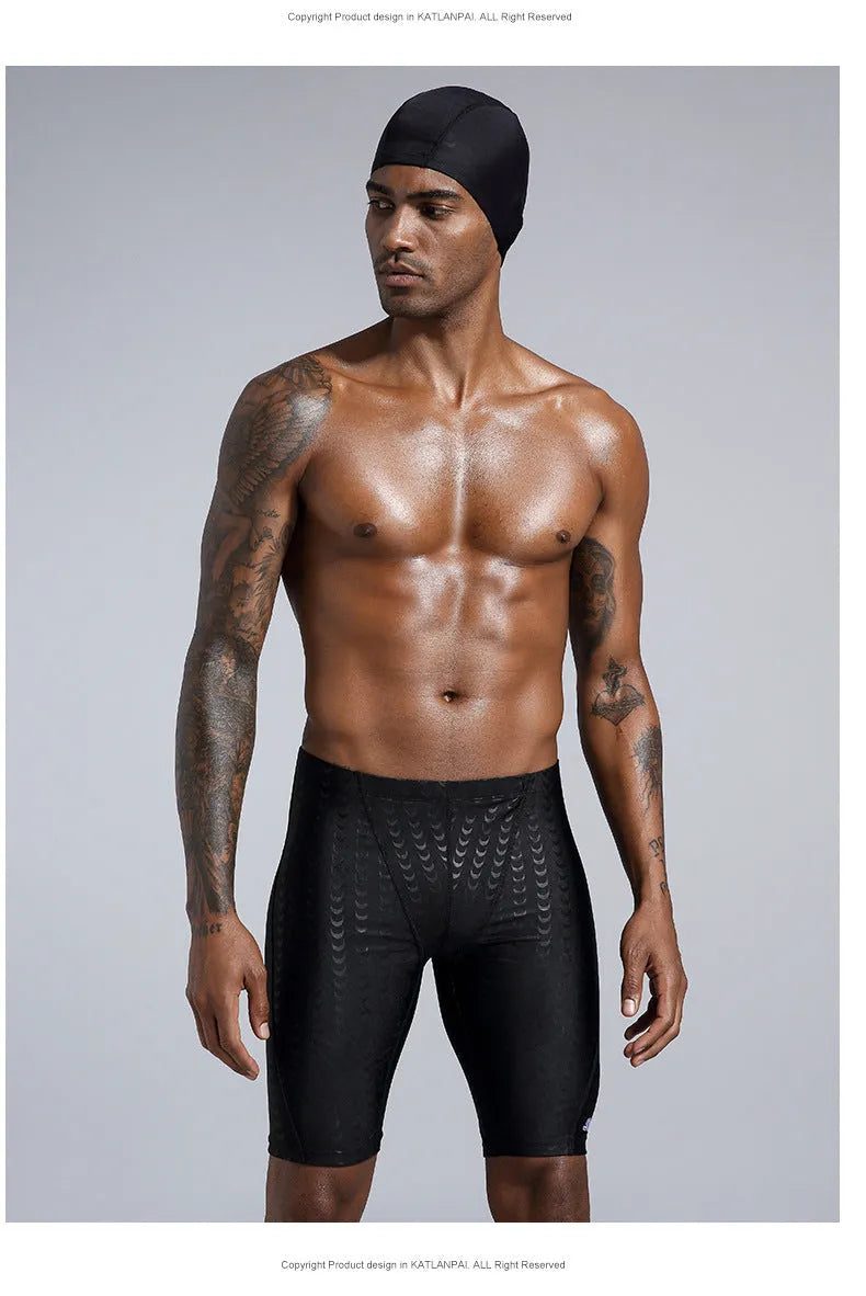 Men's solid colour waterproof shark skin fabric swimming trunks in pool setting