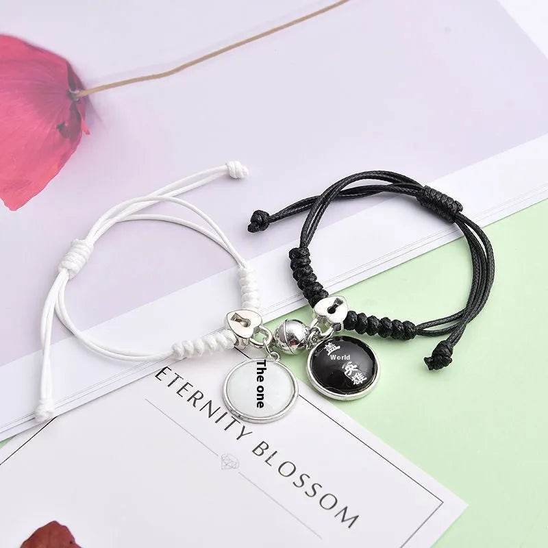 Magnetic clasp couple bracelets with alloy construction and symbolic designs including crown and love lock motifs.