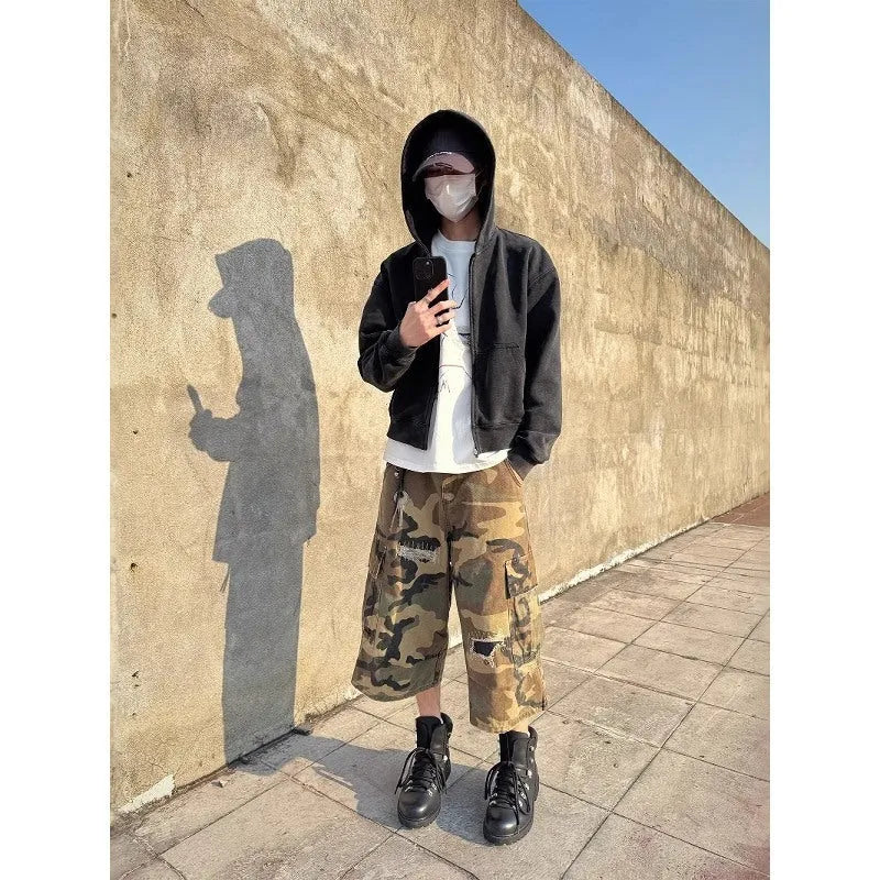 Men's loose straight leg jeans in camouflage colour with ripped patch details and a cropped ankle length