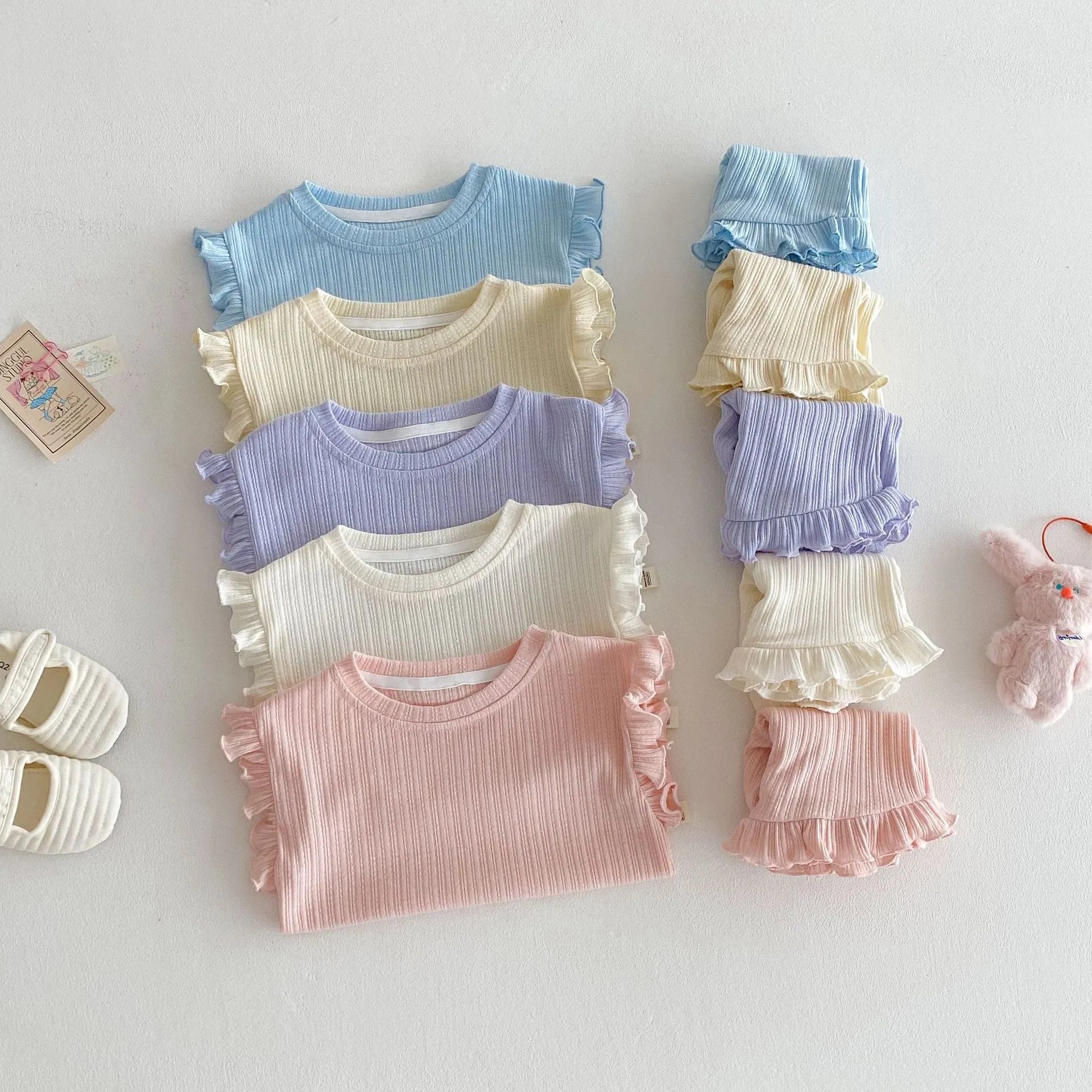 Baby girl two-piece cotton shorts set in light beige with wooden ear vest top and matching shorts