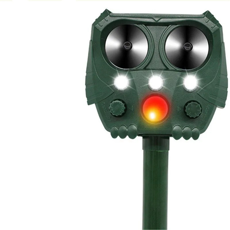 Green solar-powered ultrasonic dog repeller unit for outdoor garden protection