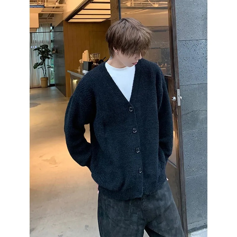 Men's loose-fit V-neck knit cardigan in army green, shown on a hanger.