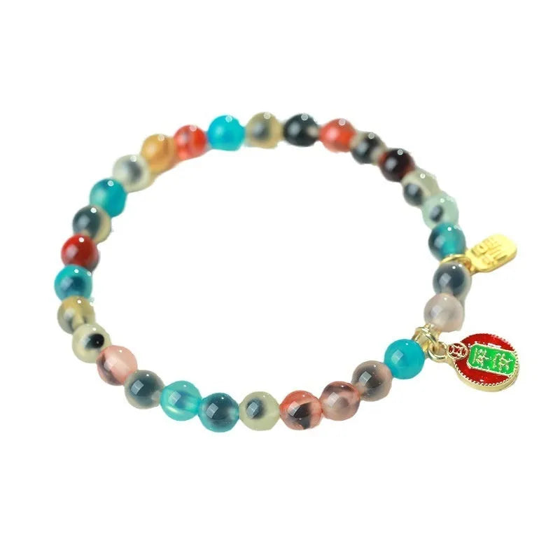Women's agate bracelet with copper coin snake chain and coloured glaze detailing in geometric bead design