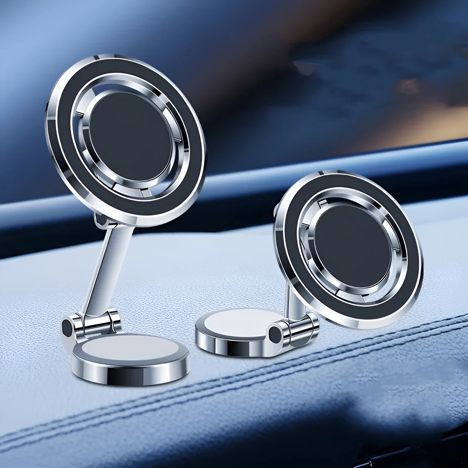Black magnetic adhesive car phone holder with 360-degree adjustable bracket mounted on a dashboard.